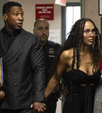 Jonathan Majors with Meagan Good At the Trial